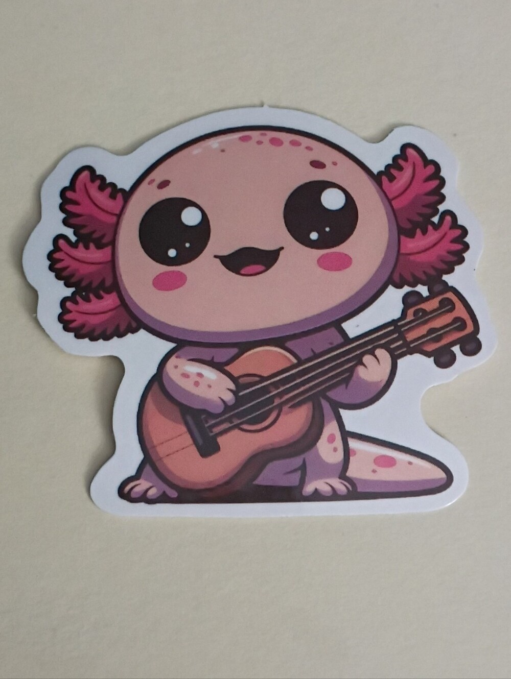 10/$10 Sticker - Axolotl Pink & Freckled - Playing Acoustic Guitar